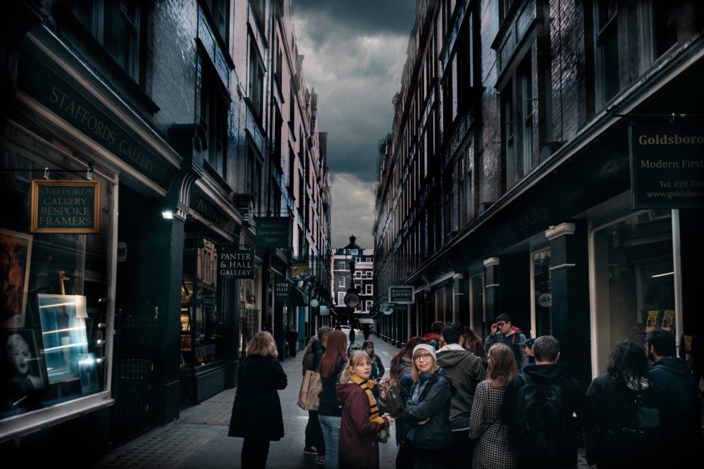 Group of people at Diagon Alley or Cecil Court on a film tour of London.