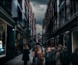 Group of people at Diagon Alley or Cecil Court on a film tour of London.